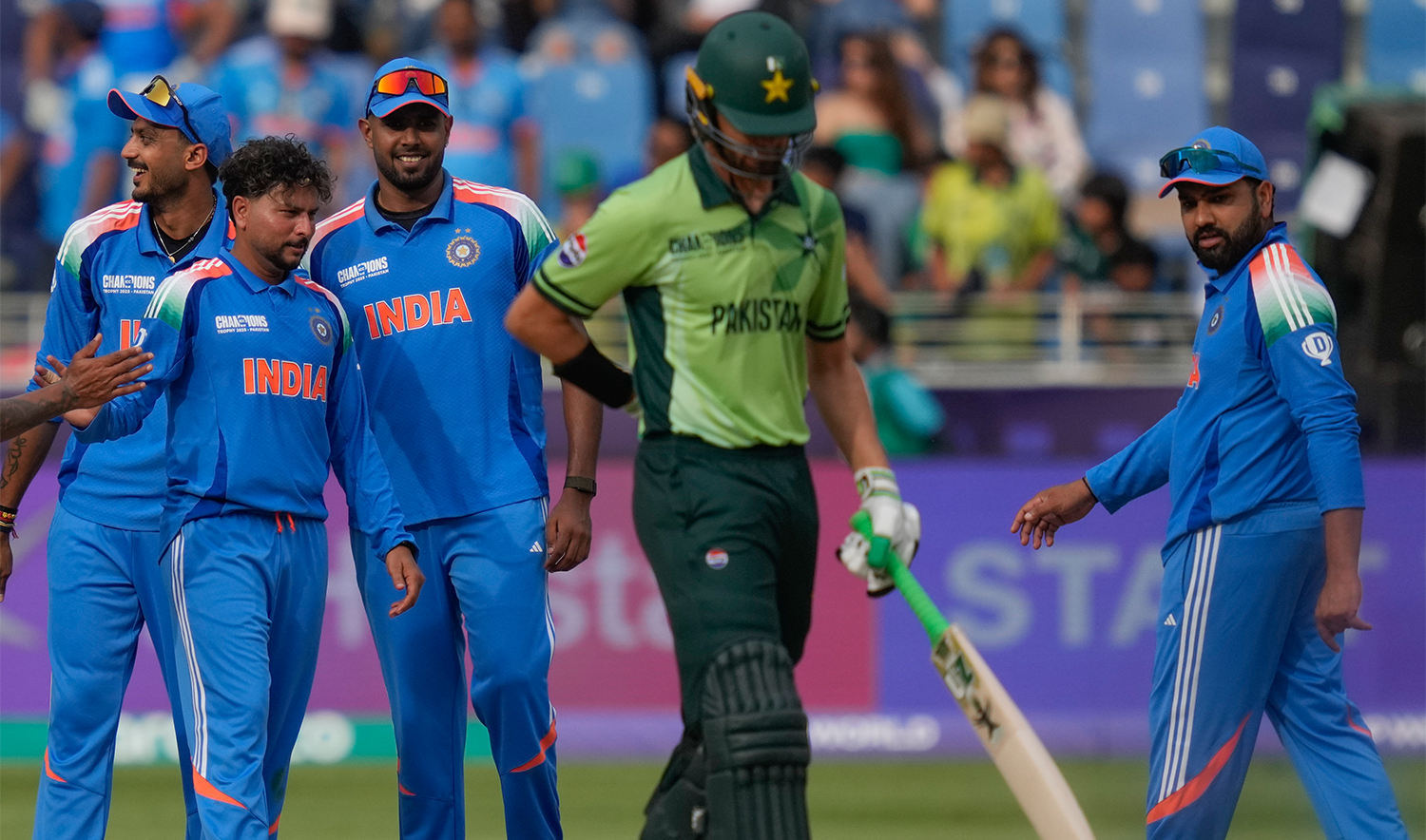 India's Kuldeep Yadav, second from left, celebrates with teammate the wicket of Pakistan's Shaheen Afridi, second from right, during the ICC Champions Trophy cricket match between India and Pakistan at Dubai International Cricket Stadium, United Arab Emirates, on Feb. 23, 2025. (AP)