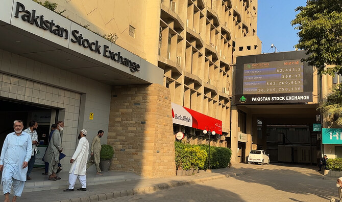 In this photo, taken on December 29, 2023, workers interact outside the Pakistan Stock Exchange in Karachi. (AN Photo/File)