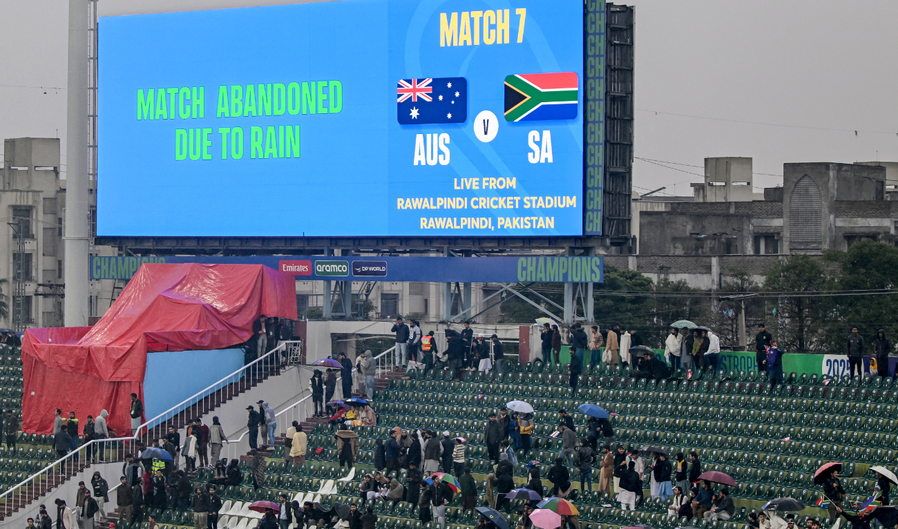 Spectators leave the stands after the ICC Champions Trophy one-day international (ODI) cricket match between Australia and South Africa was abandoned due to rain, at the Rawalpindi Cricket Stadium in Rawalpindi on February 25, 2025. (AFP)
