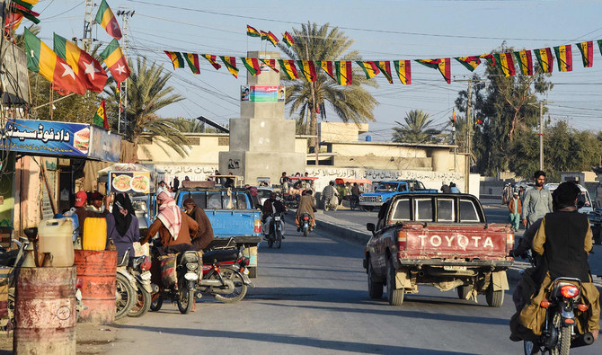 Commuters ride along a street at Panjgur district in Balochistan province on January 17, 2024. (AFP/File)