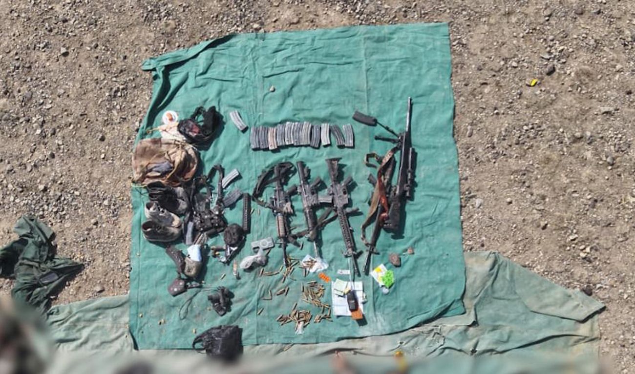 This handout photo, taken and released by Pakistan’s Inter-Services Public Relations (ISPR) on February 28, 2025, shows weapons and ammunition recovered from the slain militants during an operation in the Ghulam Khan Kalay area of North Waziristan District, Khyber Pakhtunkhwa. (Handout/ISPR)