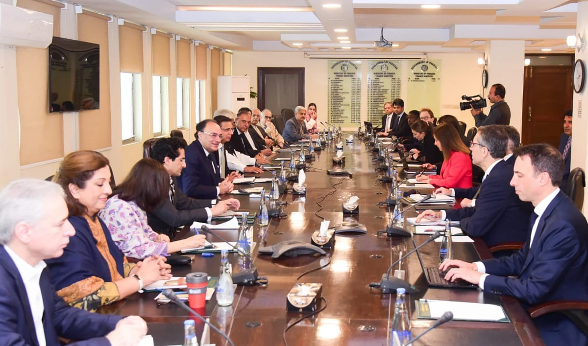 This handout photograph released by the Pakistan Press Information Department (PID) on November 12, 2024, shows Pakistan’s Finance Minister Muhammad Aurangzeb (5L) meeting with a International Monetary Fund (IMF) review mission led by Nathan Porter (3R) at the Finance Ministry in Islamabad on November 11, 2024. (PID/File)