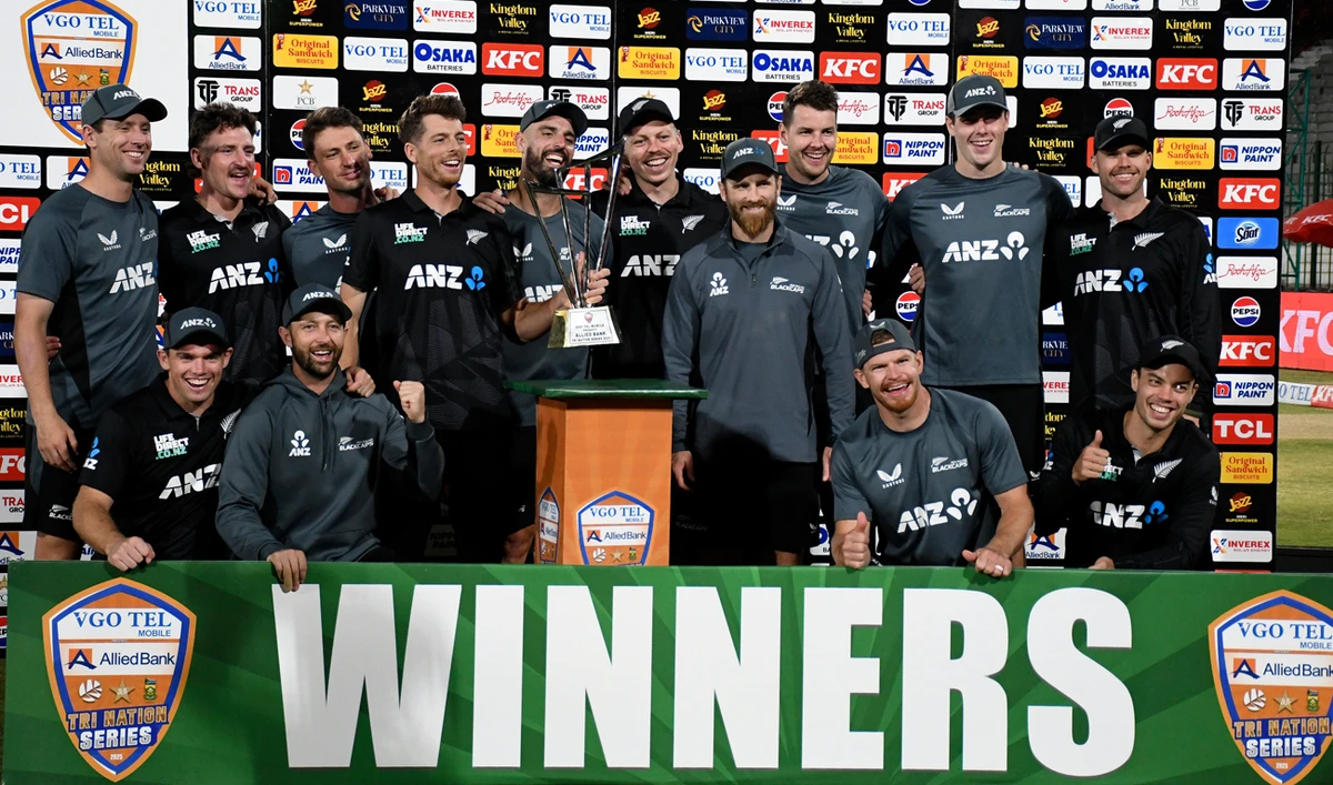 New Zealand’s players pose for photo with trophy after winning the tri-series final against Pakistan, in Karachi on February 14, 2025. (AP)