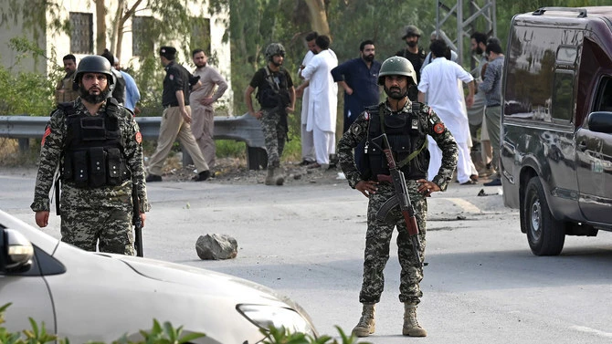 In this file photo, taken on July 18, 2023, Pakistani security personnel stand guard at the Hayatabad area of Peshawar. (AFP/File)