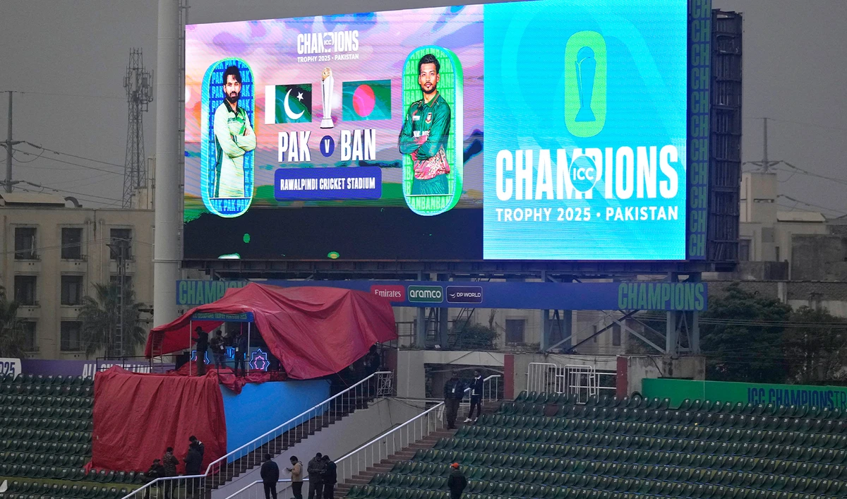 Fans leave the enclosure due to rain before start of the ICC Champions Trophy cricket match between Pakistan and Bangladesh, in Rawalpindi, Pakistan, on Feb. 27, 2025. (AP)