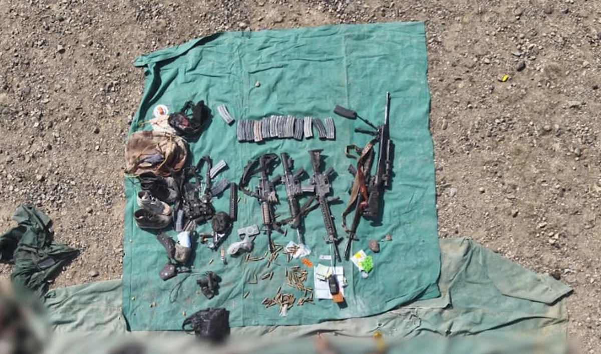 This handout photo, taken and released by Pakistan’s Inter-Services Public Relations (ISPR) on February 28, 2025, shows weapons and ammunition recovered from the slain militants during an operation in the Ghulam Khan Kalay area of North Waziristan District, Khyber Pakhtunkhwa. (Handout/ISPR)