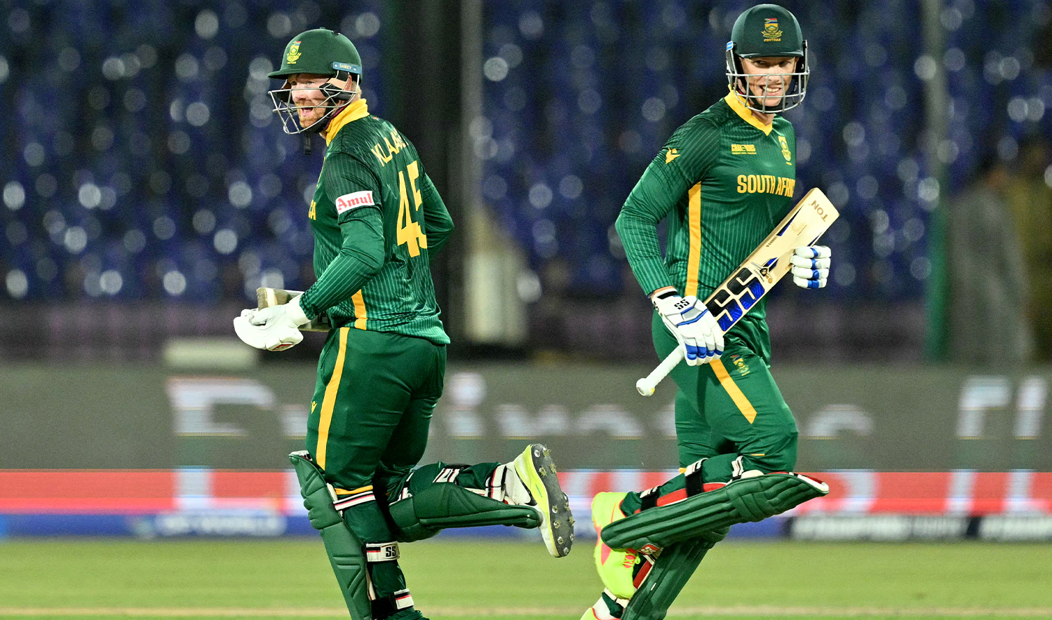 South Africa's Rassie van der Dussen (R) and Heinrich Klaasen run between the wickets during the ICC Champions Trophy one-day international (ODI) cricket match between England and South Africa at National Stadium in Karachi on March 1, 2025. (AFP/File)