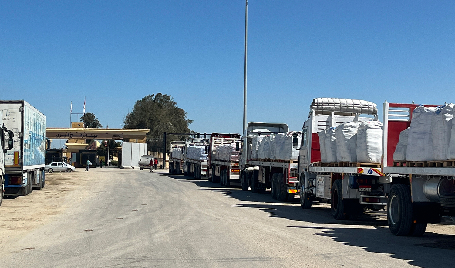 Trucks line up at the Egyptian side of the Rafah border crossing between Egypt and the Gaza Strip on March 2, 2025. (AP)