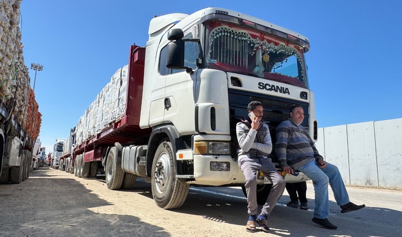 Trucks carrying humanitarian aid line up on the Egyptian side of the Rafah border crossing with the Gaza Strip on March 2, 2025, after Israel suspended the entry of supplies into the Palestinian enclave. (AFP/file)
