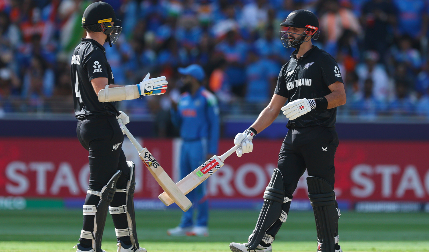 New Zealand's Daryl Mitchell, right, celebrates with batting partner Michael Bracewell after scoring fifty runs during the ICC Champions Trophy final cricket match between India and New Zealand at Dubai International Cricket Stadium in Dubai, United Arab Emirates, on March 9, 2025. (AP/File)