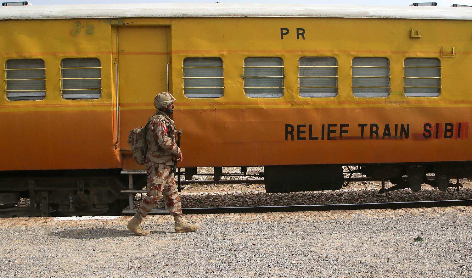 A Pakistan Army soldier walks next to a rescue train, after the attack on a train by separatist militants in Bolan, at the railway station in Mushkaf, Balochistan, Pakistan, on March 12, 2025. (REUTERS)