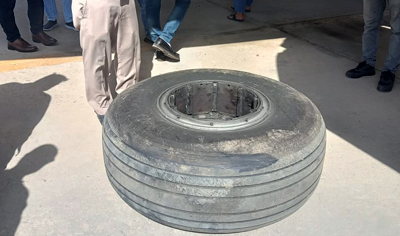 This handout photo, released by Pakistan’s Civil Aviation Authority on March 14, 2025, shows missing wheel from Lahore-bound PIA flight 306 found at the Jinnah International Airport in Karachi. (Handout/PCAA)