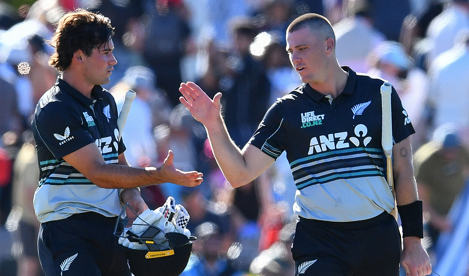 New Zealand's Finn Allen (R) and Tim Robinson celebrate their win during the first Twenty20 international cricket match between New Zealand and Pakistan at Hagley Oval in Christchurch on March 16, 2025. (AFP)