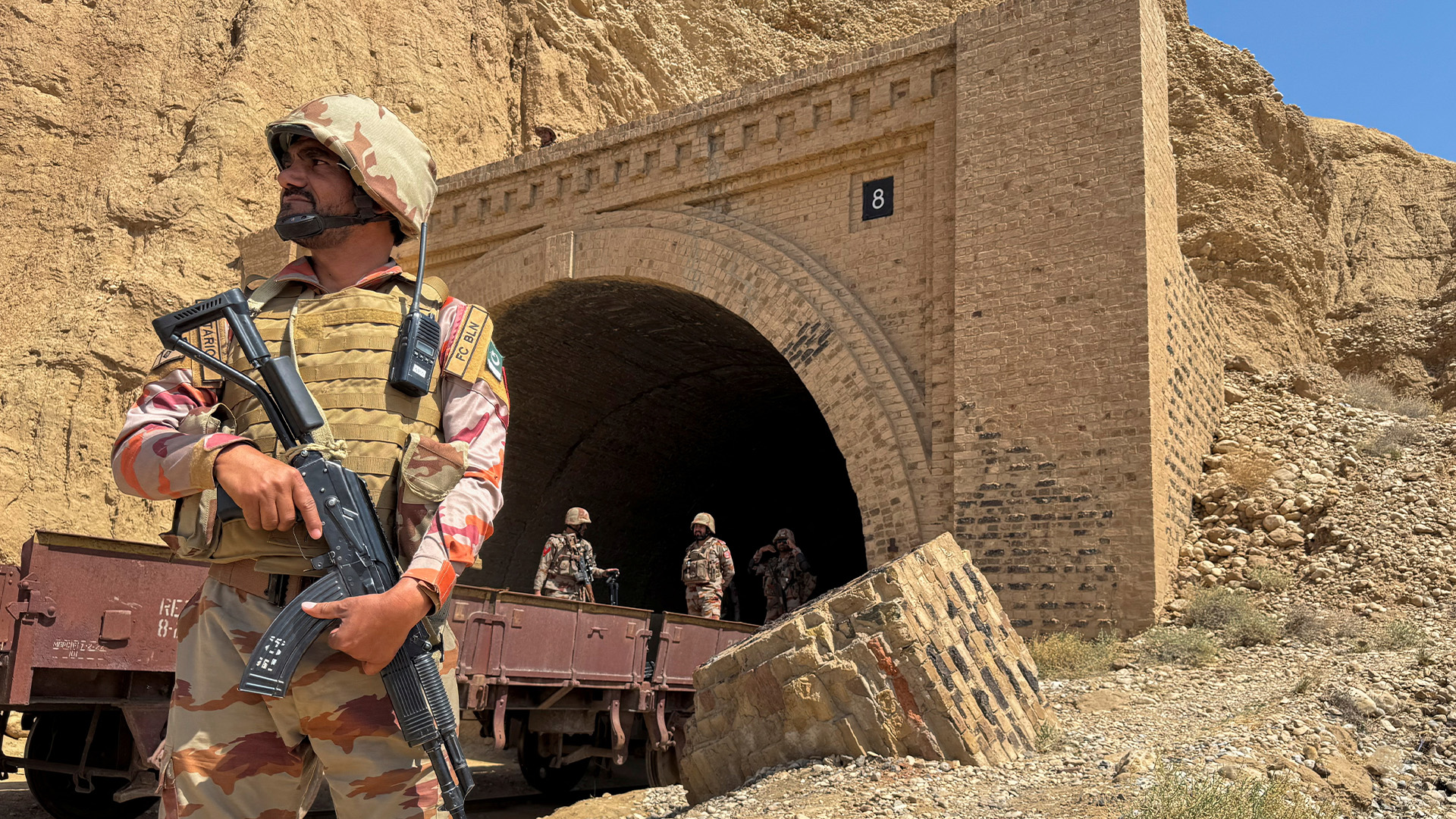 Pakistan army soldiers stand at a tunnel where the Jaffar Express train was attacked by separatist militants, in Bolan, Balochistan, Pakistan, March 15, 2025. (Reuters)