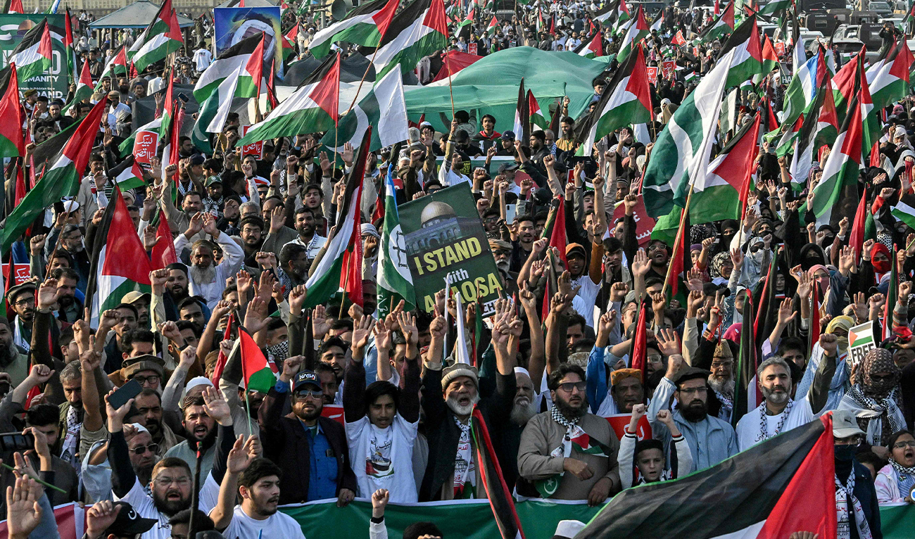 Activists of Pakistan’s Jamaat-e-Islami (JI) party shout pro-Palestinian slogans as they hold placards and flags during a march to express their solidarity with the Palestinians, in Karachi on January 12, 2025. (AFP/File)