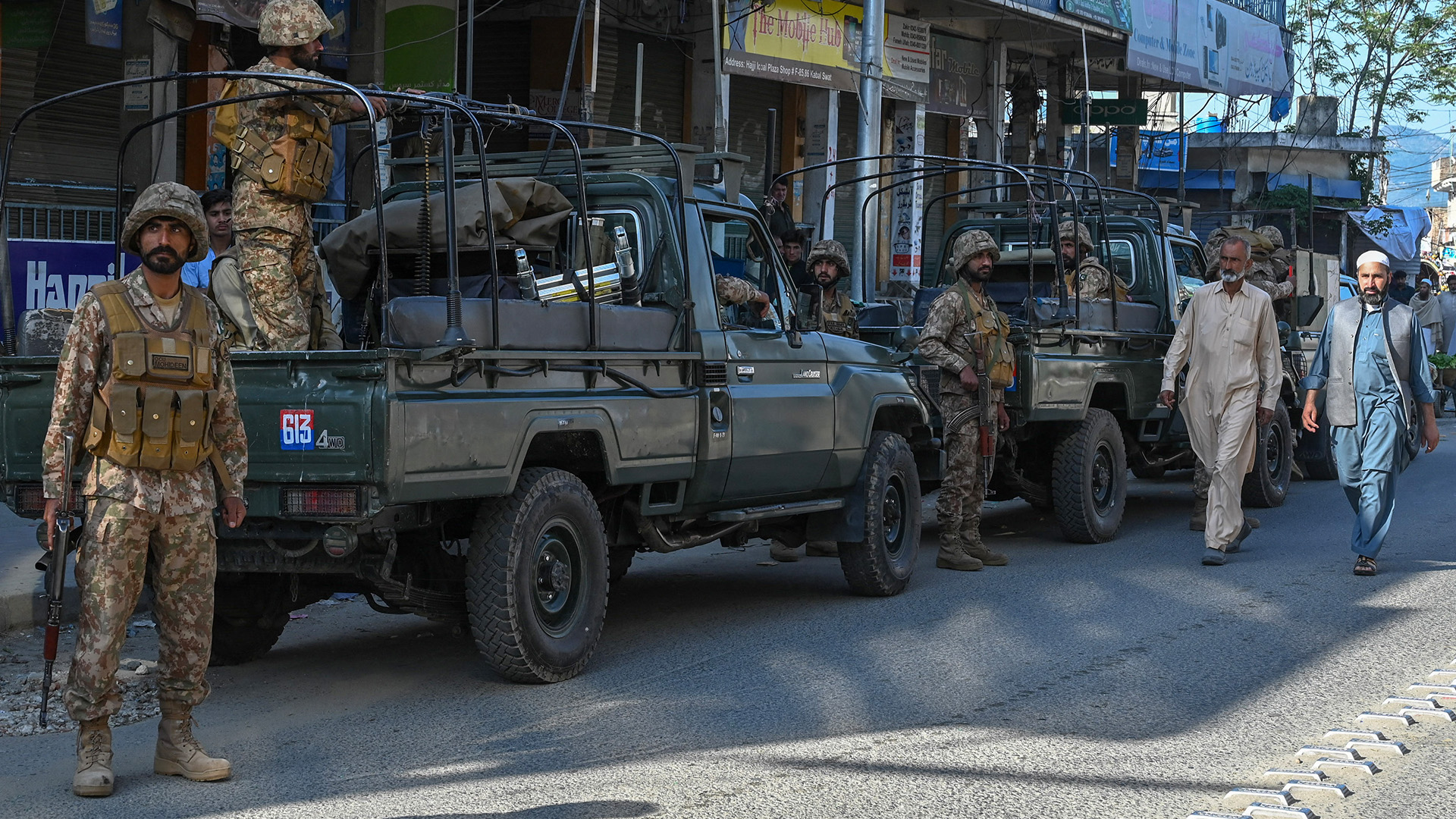 Army troops stand guard along a street in Kabal town of Swat Valley in Pakistan’s northwestern region of Khyber Pakhtunkhwa province on April 25, 2023. (AFP/File)