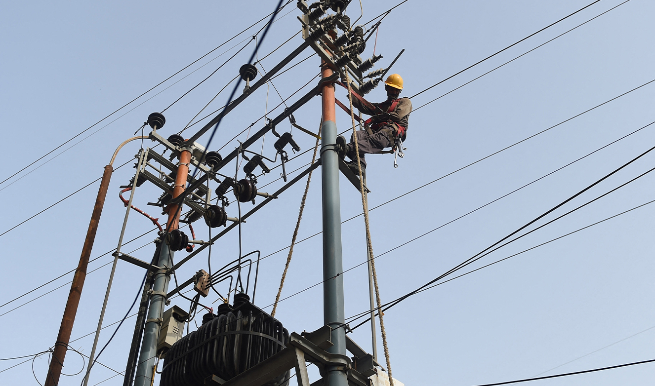 Pakistani technicians of the Karachi Electric Corporation work on a high voltage line in Karachi on August 31, 2016. (AFP/File)