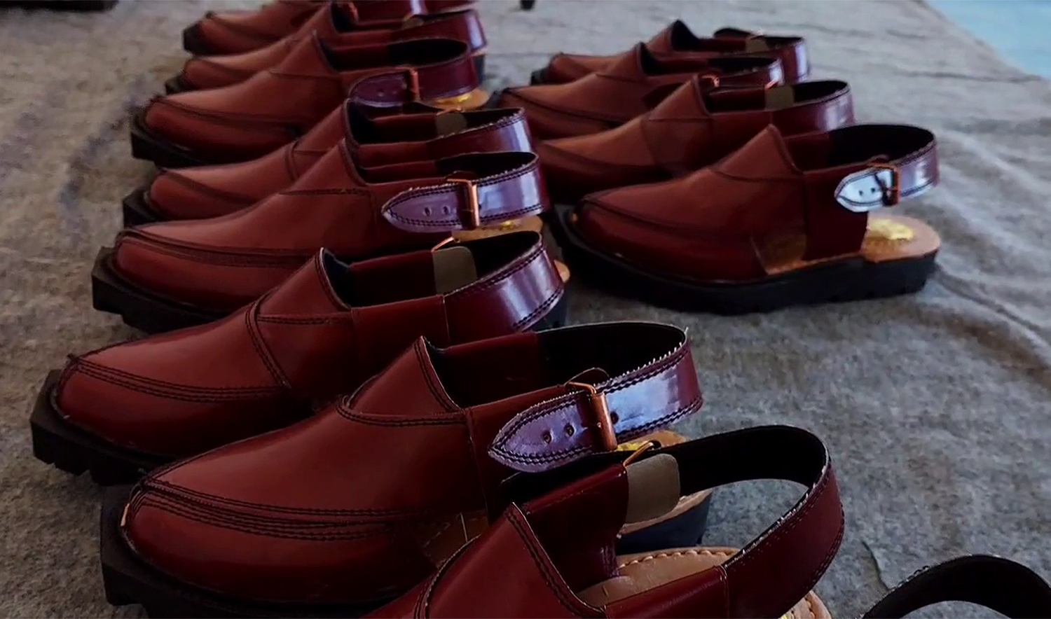 A screengrab taken from a video released by the Punjab home department on March 23, 2025, shows traditional handmade chappals crafted by prison labor at the District Jail in Shahpur, Pakistan. (Screengrab/ Punjab Home Department)