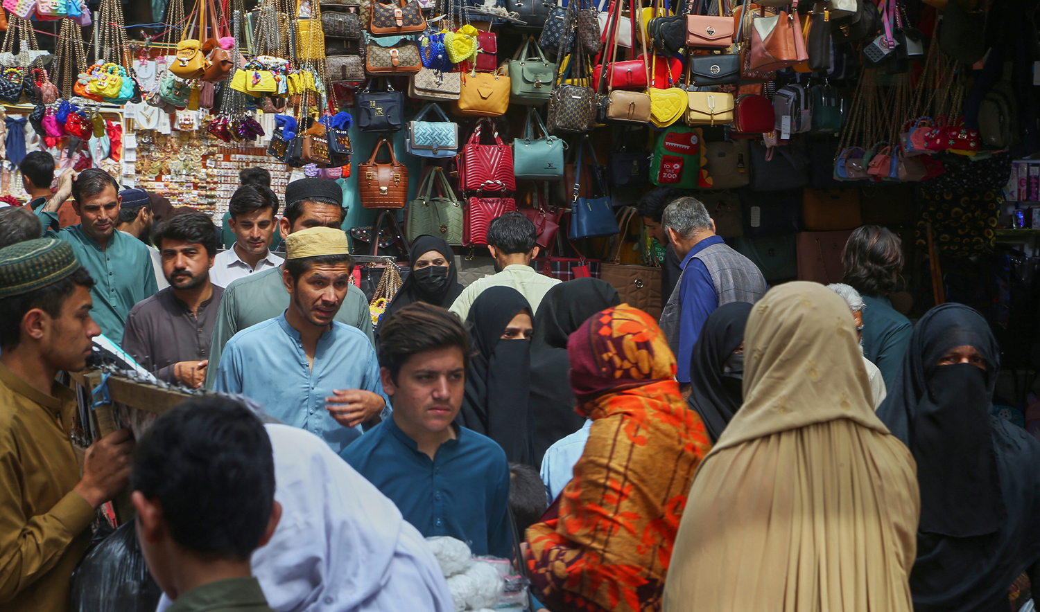 People visit a market to shop for the upcoming Eid al-Fitr celebrations, which marks the end of the Islamic holy month of Ramadan, in Peshawar, Pakistan, on March 24, 2025. (AP)
