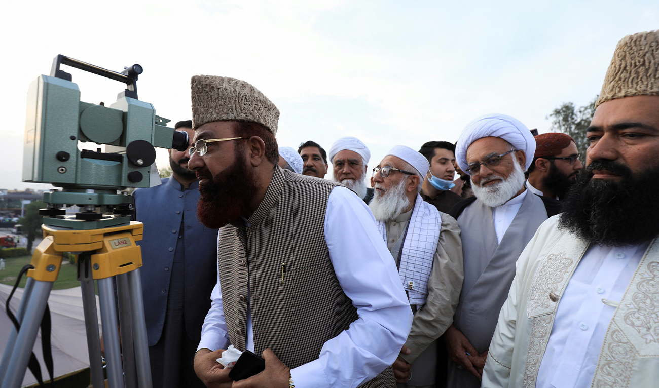 Members of the moon sighting committee uses a theodolite to look for the new moon that will mark the start of the holy month of Ramadan, in Peshawar, Pakistan April 13, 2021. (REUTERS/File)