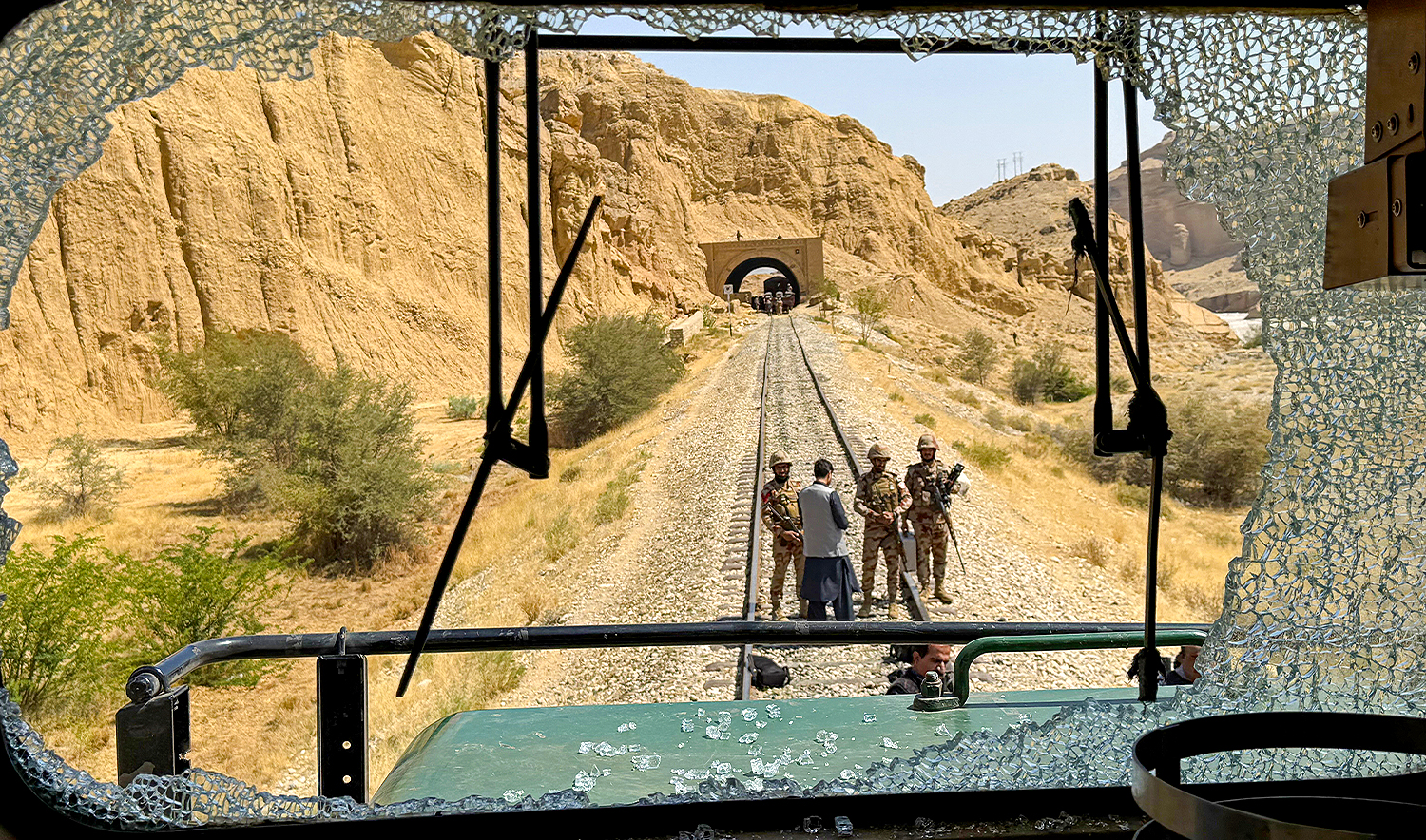 Pakistan's Frontier Corps inspect the siege site after armed militants ambushed a train in the remote mountainous area, at Pehro Kunri in Balochistan province on March 15, 2025. (REUTERS)