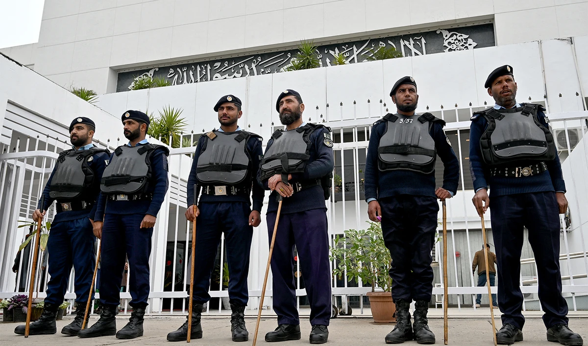 Security personnel stand guard before the start of a session of the National Assembly in Islamabad on February 29, 2024. (AFP/File)