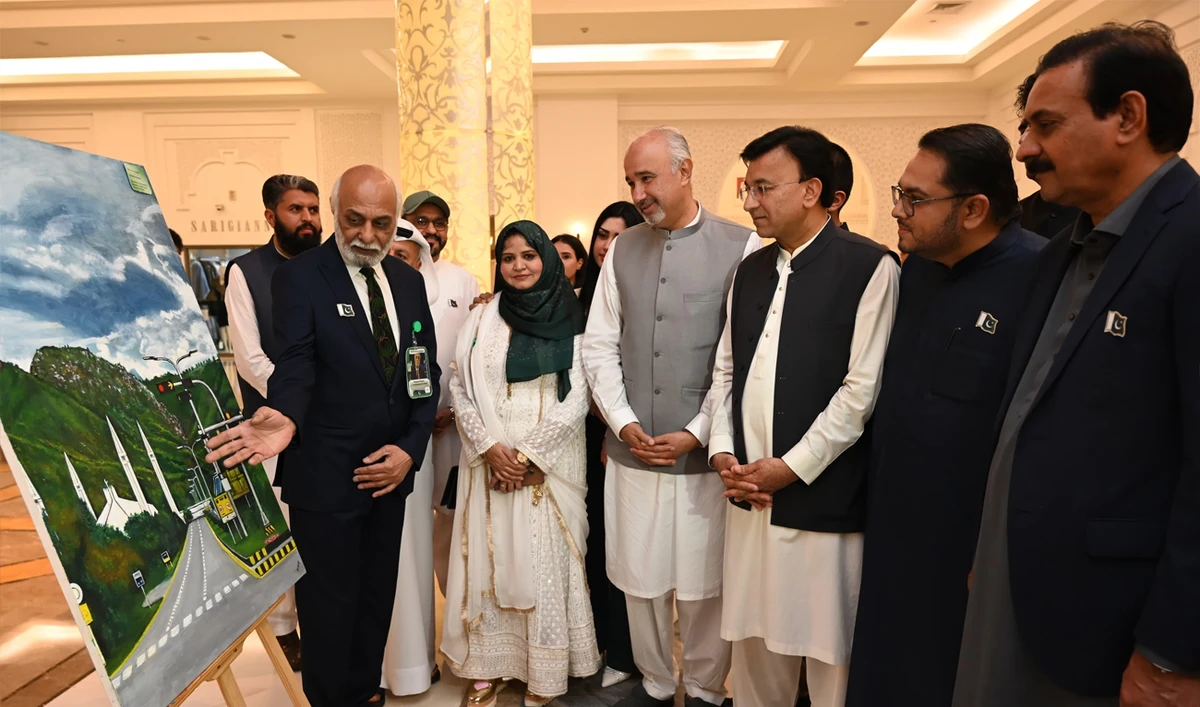 Pakistan’s envoy to the United Arab Emirates, Ambassador Faisal Niaz Tirmizi (fourth right), interacts with the exhibitors at an art exhibition in Ajman, UAE, on March 24, 2025. (Photo Courtesy: Pakistan Embassy UAE)