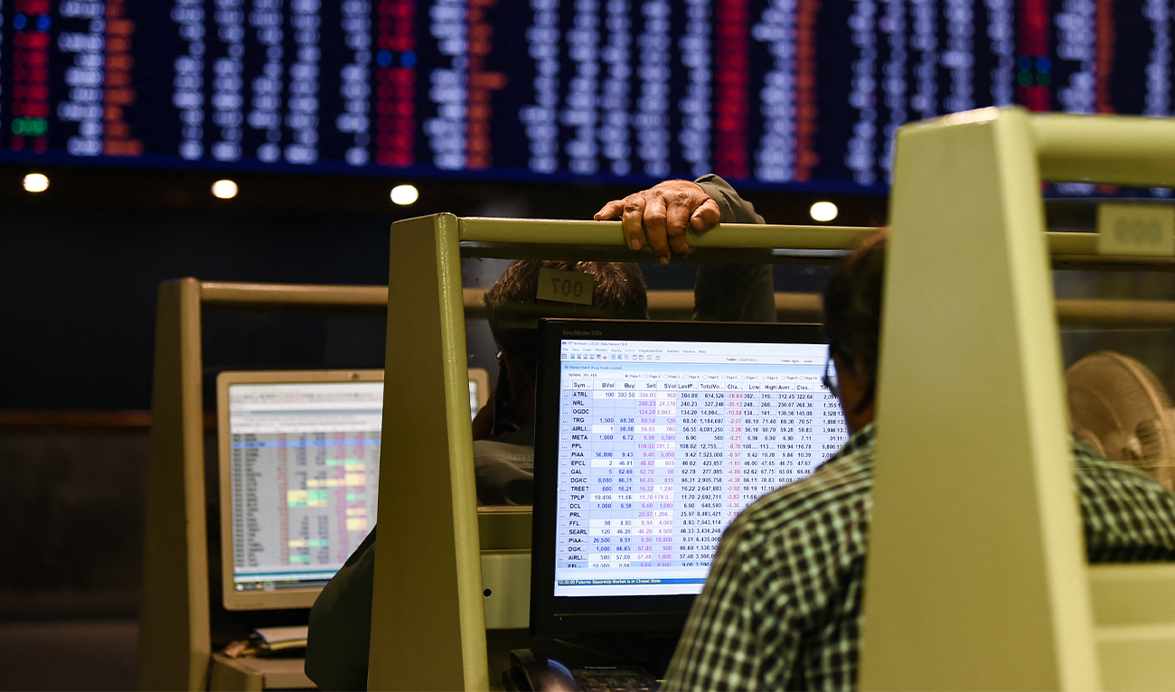 Stock brokers monitor share prices on computers during a trading session at the Pakistan Stock Exchange (PSX) in Karachi on February 12, 2024. (AFP/File)