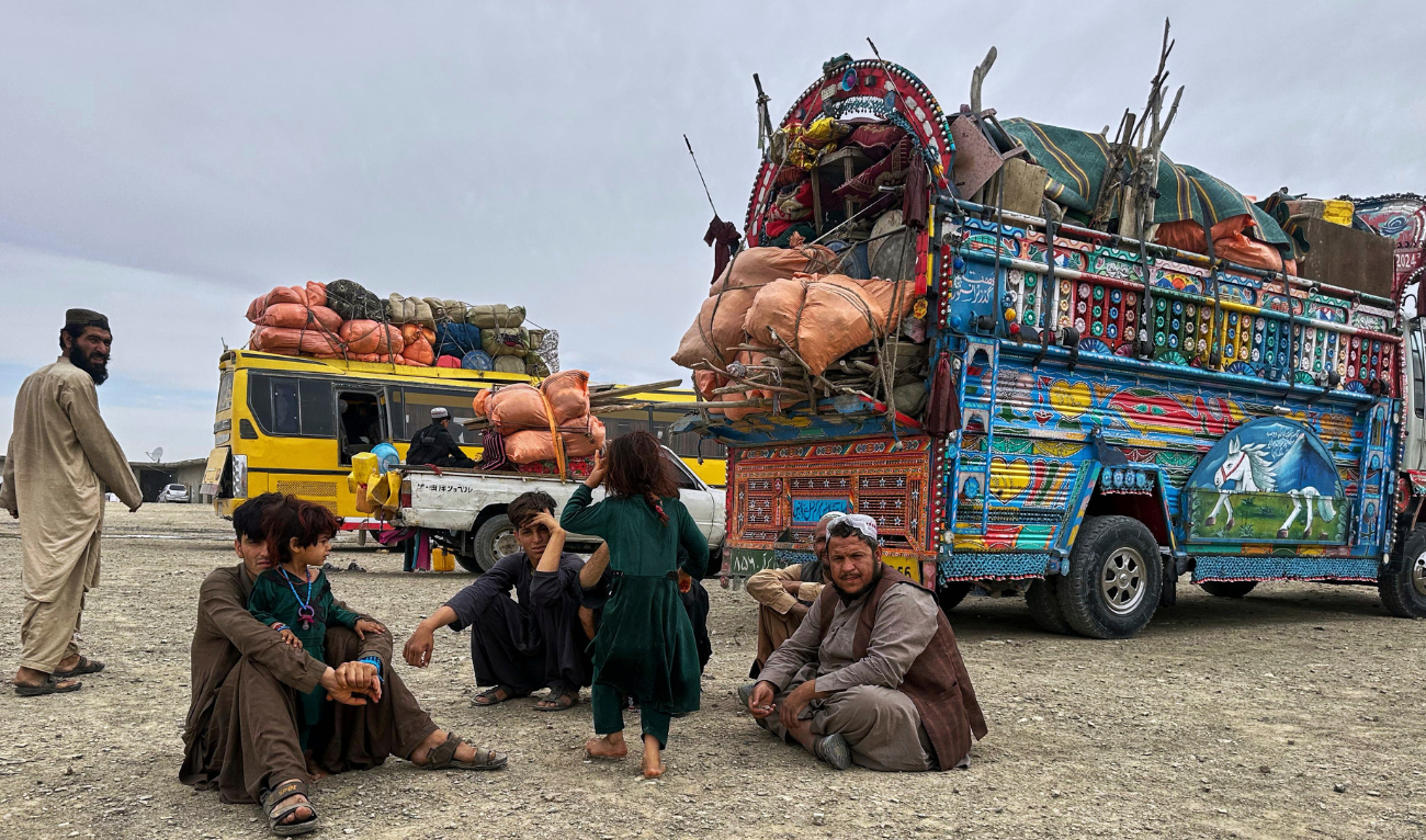 Afghan refugees take rest at a transit station setup to facilitate Afghan refugees' deportations, outskirt of Chaman, a town on the Pakistan and Afghanistan border, Tuesday, April 8, 2025. (AP Photo)