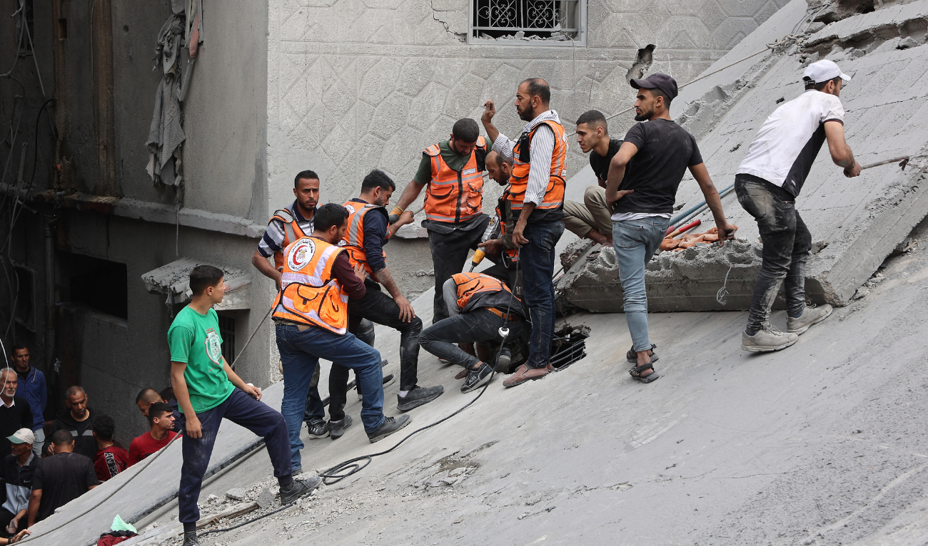 Palestinian rescuers work at the site of an Israeli strike on a residential area in Gaza City's Shujaiyya neighbourhood, on April 9, 2025. (AFP)