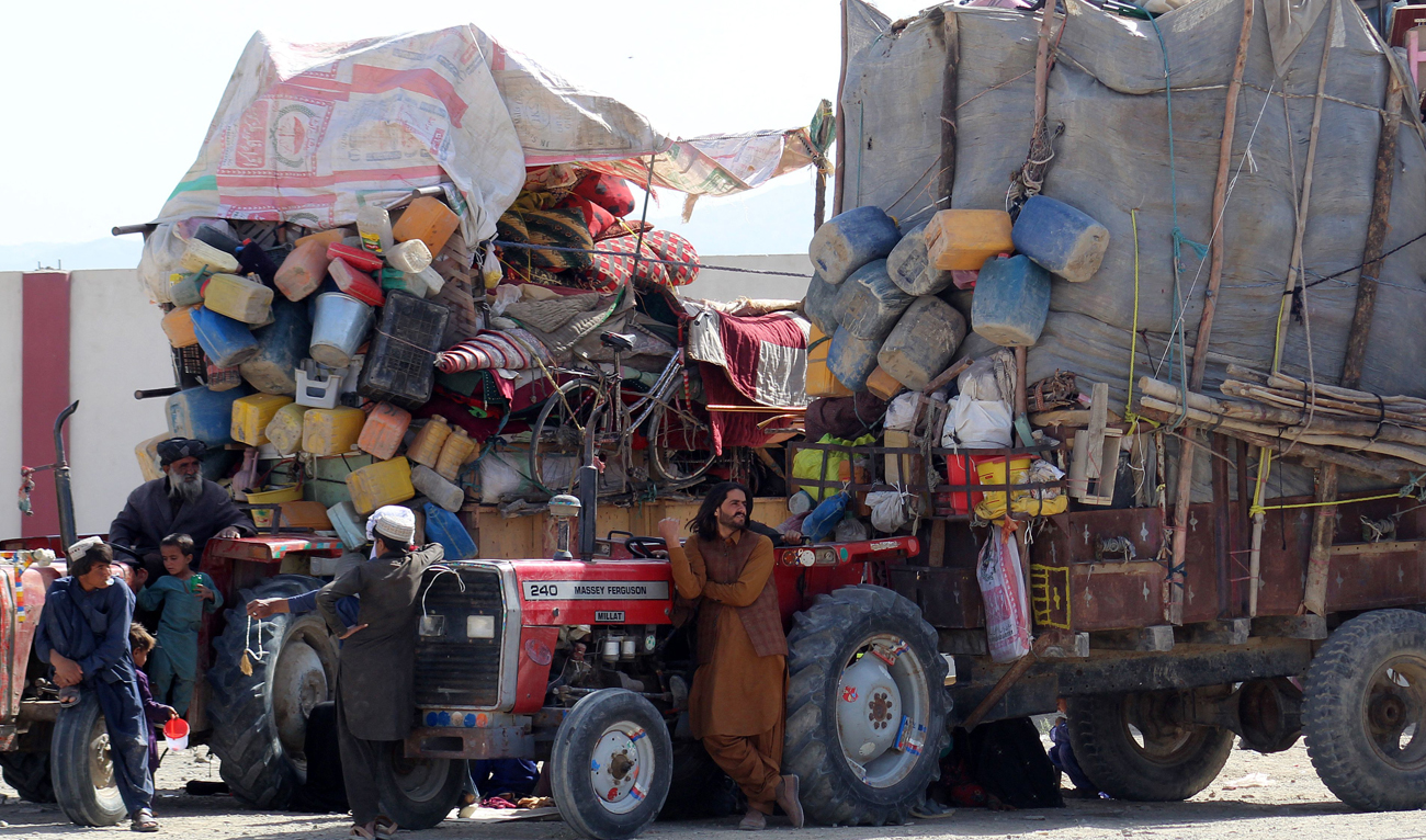 Afghan refugees along with their belongings waiting to their departure for Afghanistan, at a holding center near the Pakistan-Afghanistan border in Chaman on April 10, 2025. (AFP)