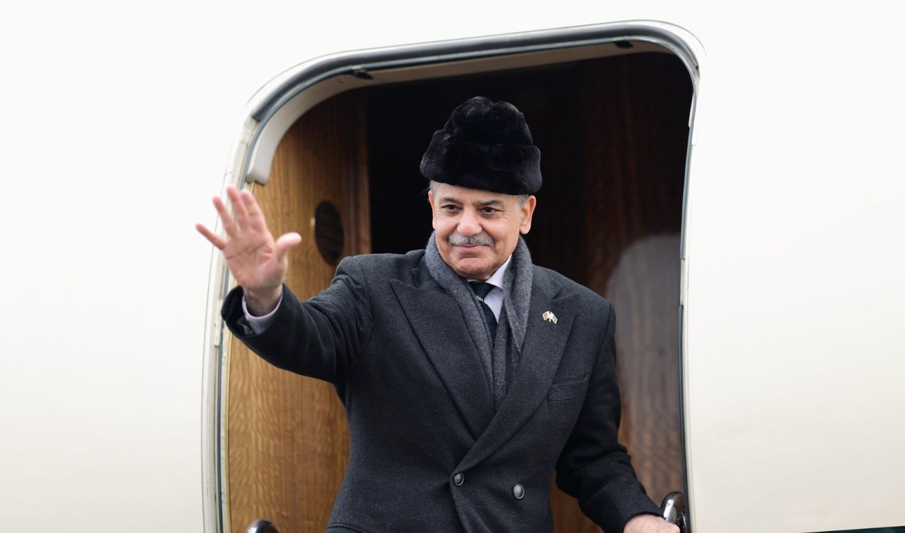Prime Minister Shehbaz Sharif waves as he boards an airplane at the at Minsk International Airport on April 11, 2025. (PMO)