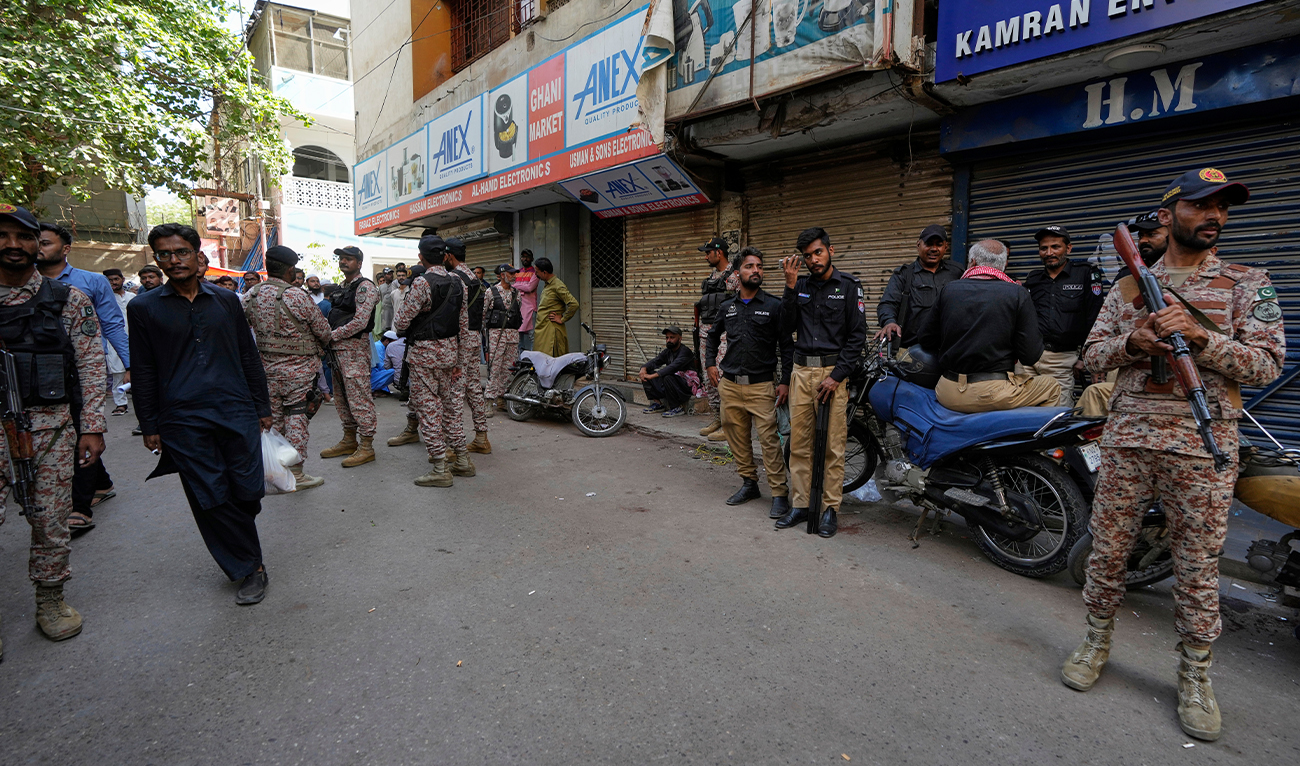 Paramilitary soldiers and police officers stand guard outside the Ahmadi community’s place of worship in Karachi, Pakistan, on April 18, 2025. (AP)