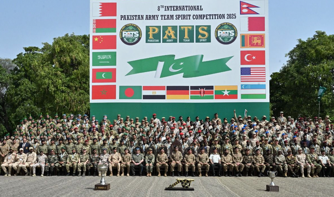 This handout photo, taken and released by Pakistan’s Inter-Services Public Relations (ISPR) on April 19, 2025, shows officials gesture for a group photograph with participants during closing ceremony at the 8th International Pakistan Army Team Spirit Exercise 2025 at the Kharian Garrison in Kharian, Punjab. (Photo courtesy: Handout/ISPR)