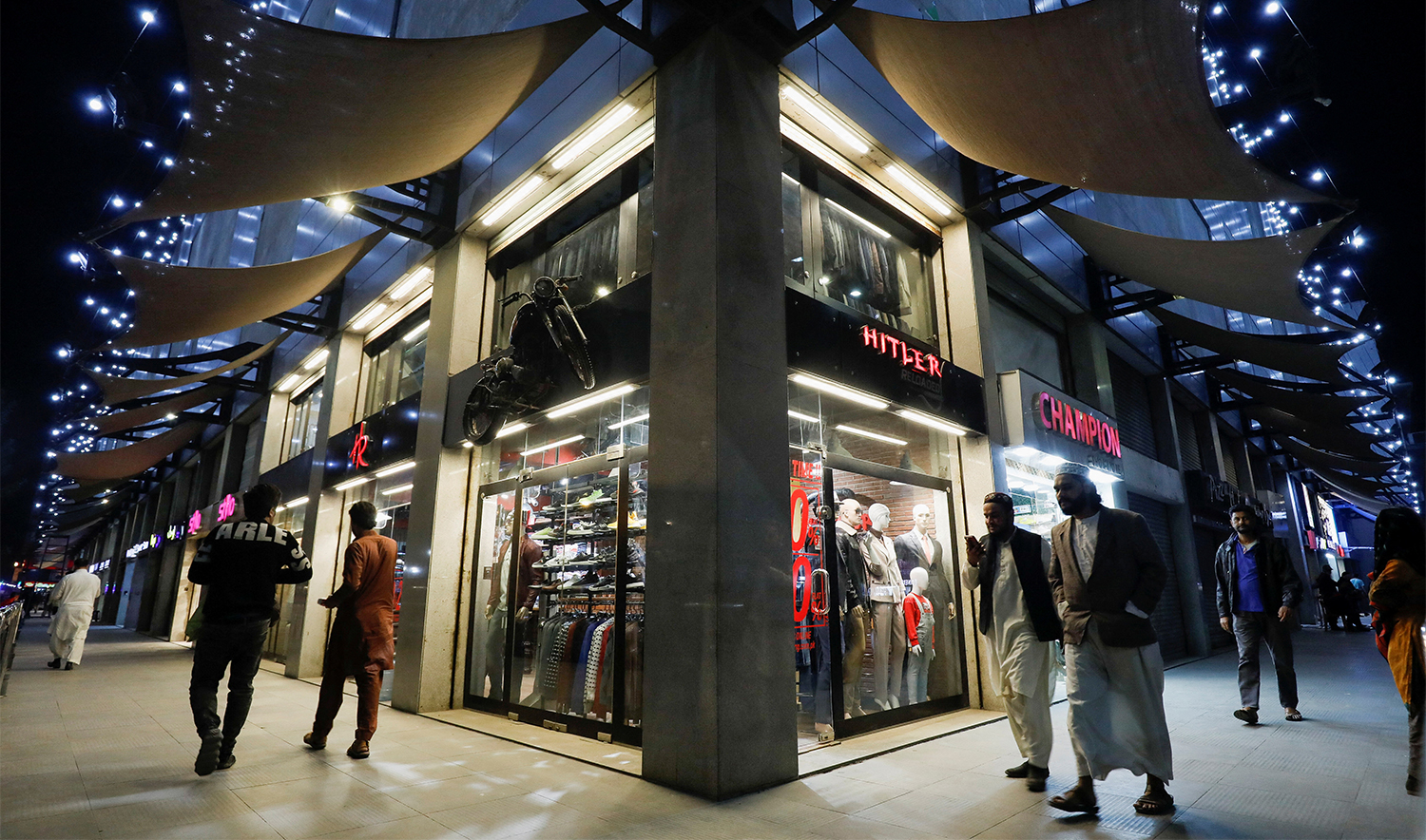 People walk outside shops at the Atrium Mall in Karachi, Pakistan, on January 3, 2023. (REUTERS/File)