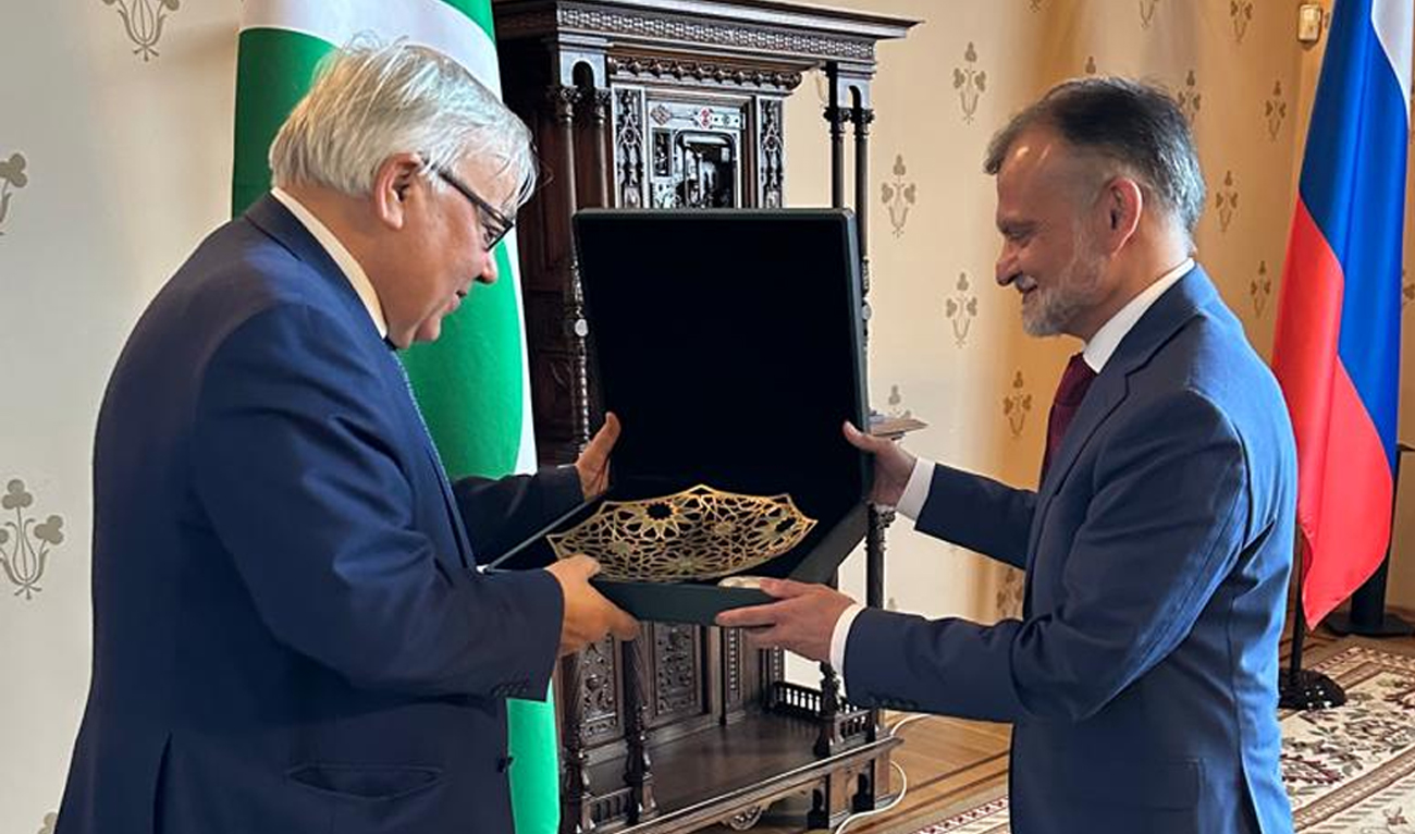 The handout photograph released by Pakistan’s Ministry of Foreign Affairs shows Russia’s Deputy Foreign Minister, Sergey Vershinin, presenting a souvenir to Pakistan’s Special Secretary to the United Nations, Nabeel Munir (right), during the 11th meeting of the Pakistan-Russia Joint Working Group to Counter International Terrorism in Moscow on April 22, 2025. (MOFA Pakistan)