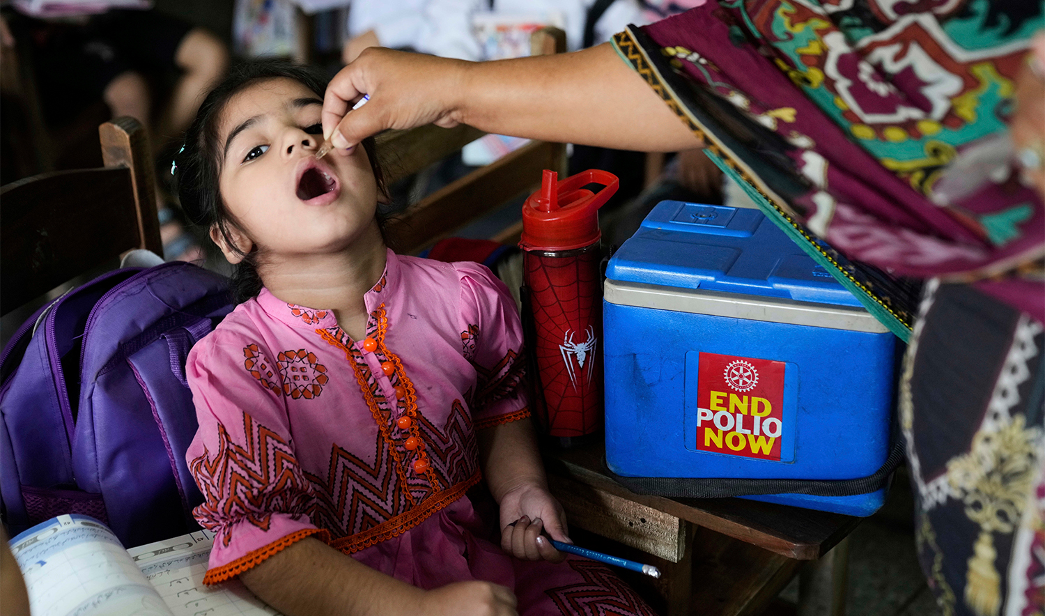 A health worker administers a polio vaccine to a child in a school in Lahore, Pakistan, on April 21, 2025. (AP/File)
