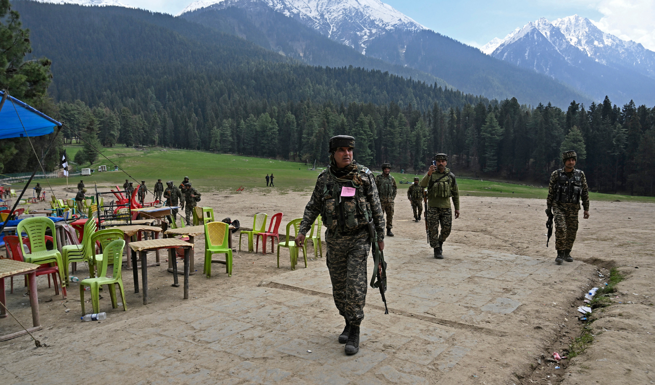 Security personnel inspect the site in the aftermath of an attack as food stall chairs lie empty in Pahalgam, about 90km (55 miles) from Srinagar on April 23, 2025. (AFP)