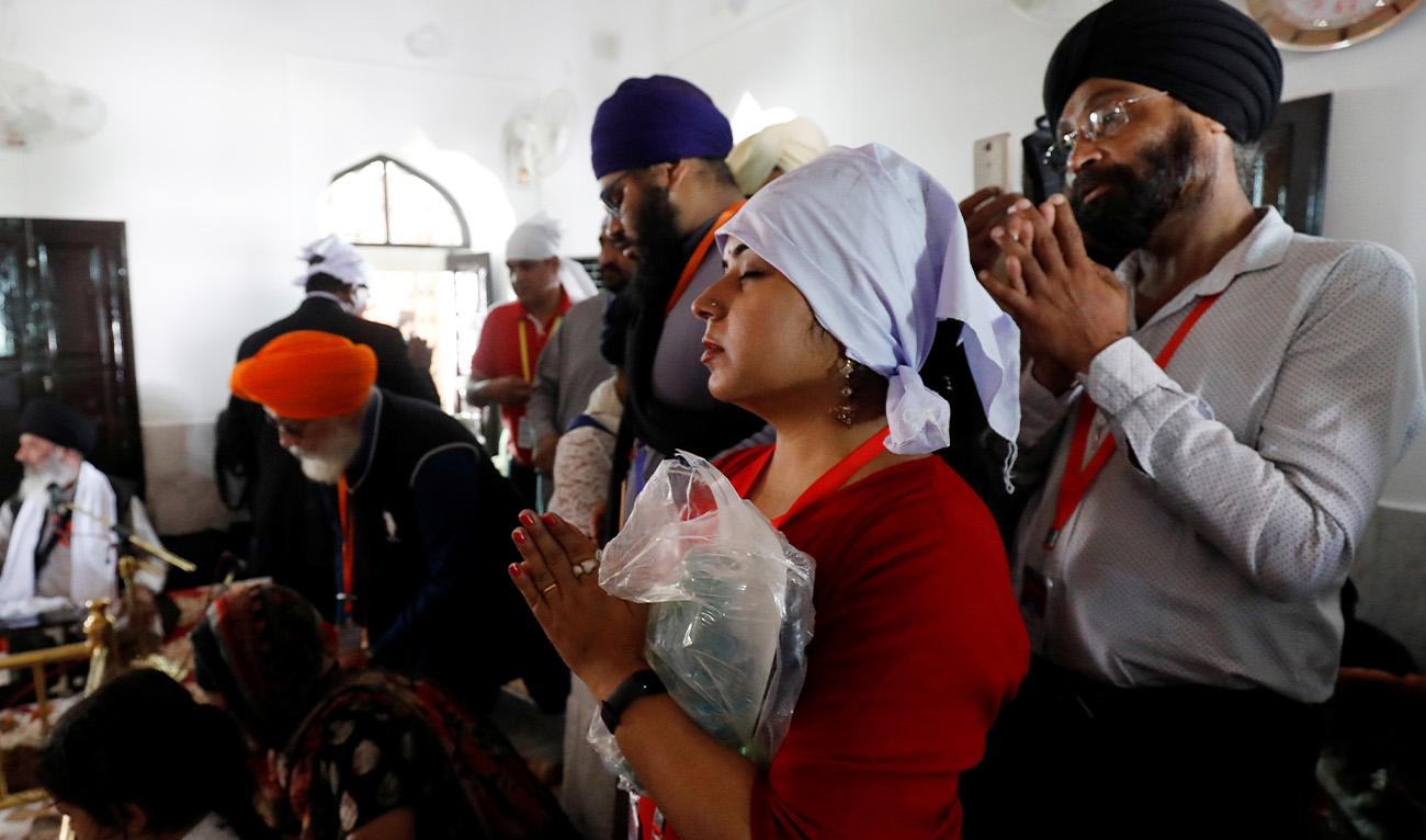Indian Sikh pilgrims hold their palms in respect as they visit the Gurdwara Darbar Sahib in Kartarpur, Pakistan November 9, 2019. (Reuters/File)