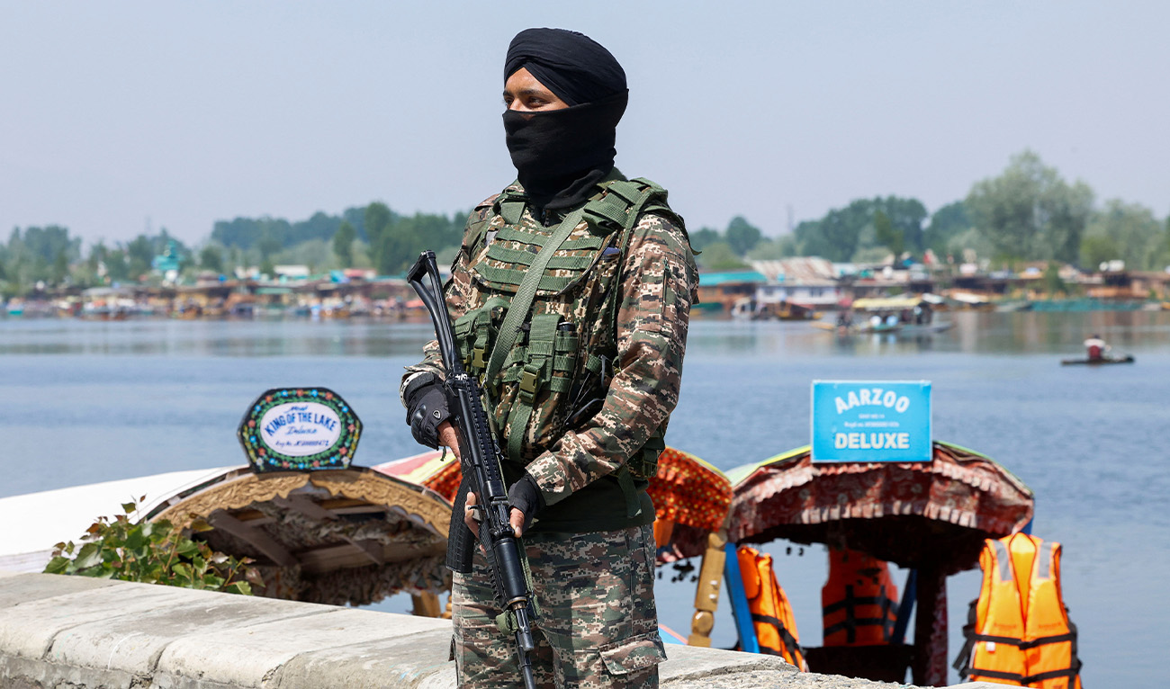 Indian security force personnel stands guard on the banks of Dal Lake, following a suspected militant attack near south Kashmir's Pahalgam, in Srinagar, Indian administrated Kashmir, April 27, 2025. (Reuters)