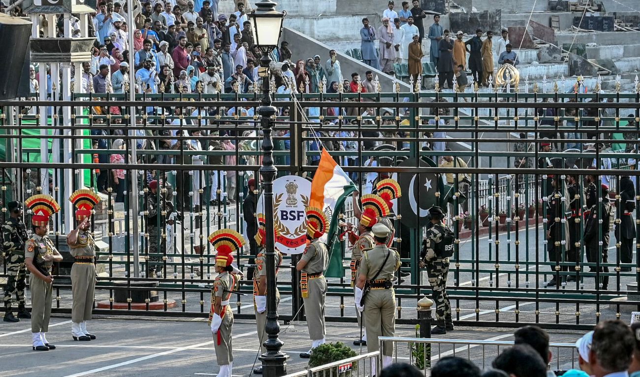 Indian Border Security Force personnel (brown) and Pakistani Rangers (black) take part in the beating retreat ceremony at the border gates of India and Pakistan at the Wagah border post, about 35 km from Amritsar on April 25, 2025. (AFP/ File)