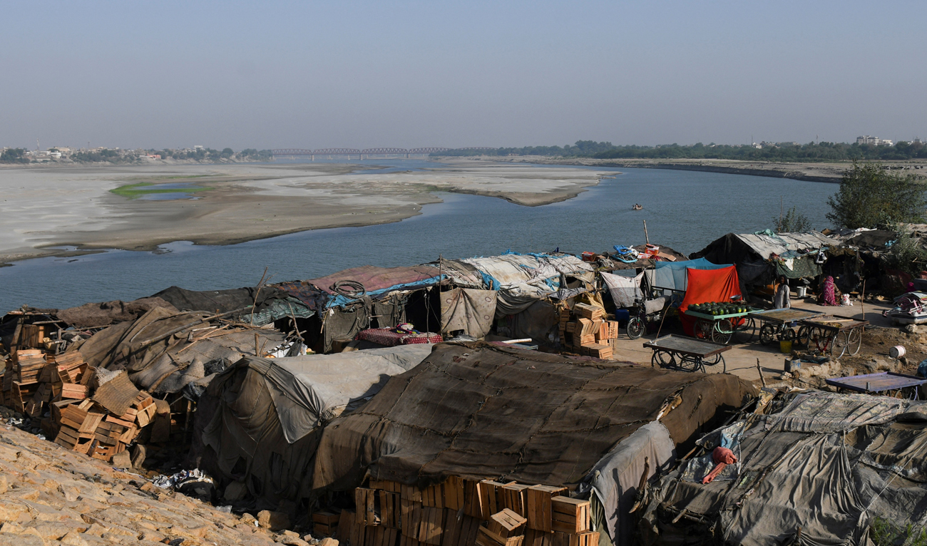 A view of tent houses, belonging to squatters, on the dry riverbed of the Indus River in Hyderabad, Pakistan on April 25, 2025. (REUTERS)