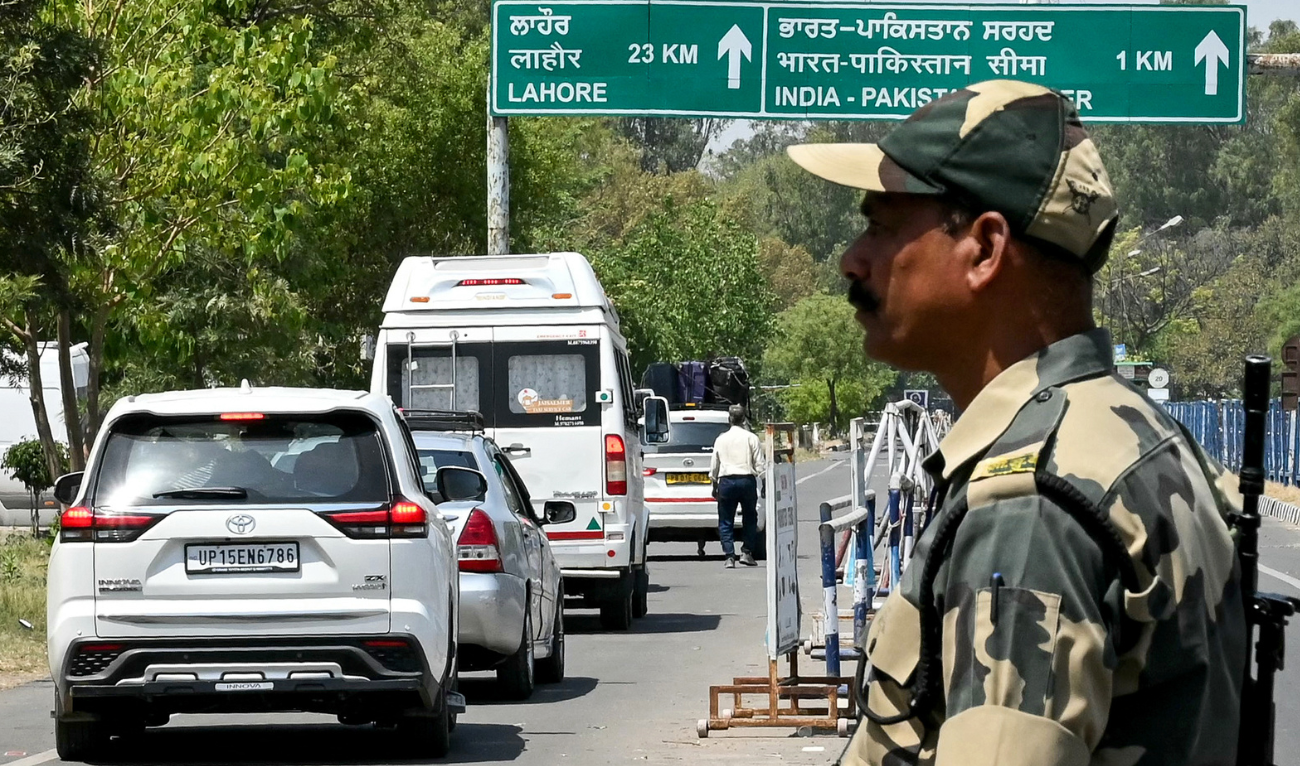 An Indian Border Security Force (BSF) personnel stands guard as Pakistani citizens return to their country through the India-Pakistan Attari-Wagah border post, about 35kms from Amritsar on April 26, 2025,. (AFP)