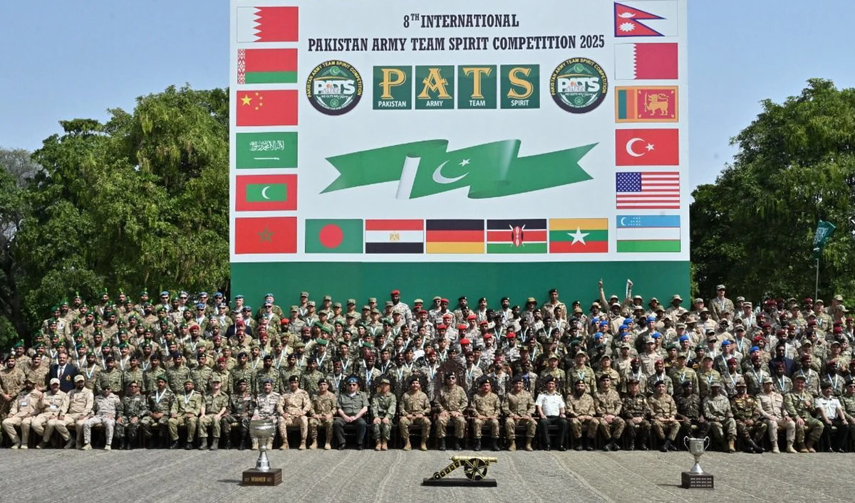 This handout photo, taken and released by Pakistan’s Inter-Services Public Relations (ISPR) on April 19, 2025, shows officials gesture for a group photograph with participants during closing ceremony at the 8th International Pakistan Army Team Spirit Exercise 2025 at the Kharian Garrison in Kharian, Punjab. (Photo courtesy: Handout/ISPR)