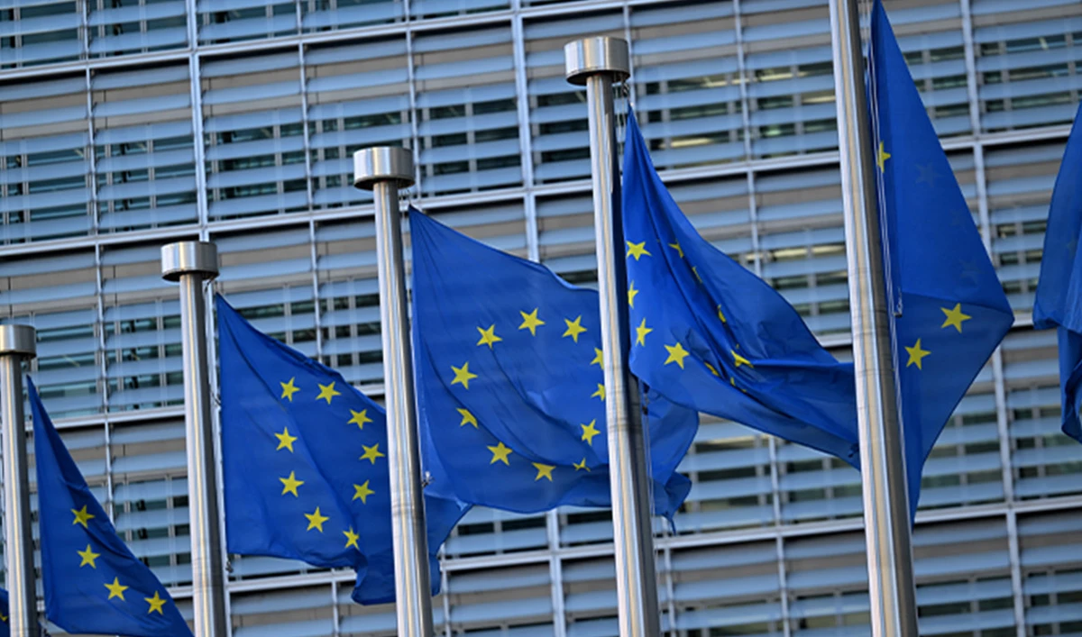 This photograph taken on March 19, 2025 shows European flags outside the EU headquarters in Brussels. (AFP/File)