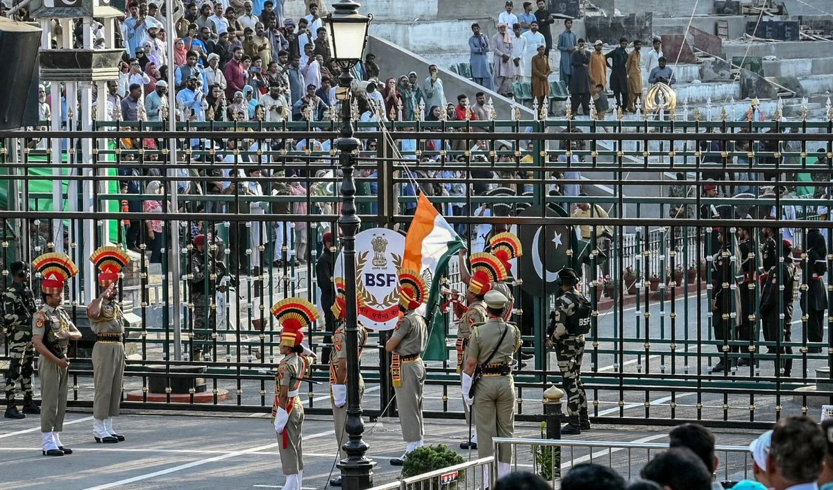 Indian Border Security Force personnel (brown) and Pakistani Rangers (black) take part in the beating retreat ceremony at the border gates of India and Pakistan at the Wagah border post, about 35 km from Amritsar on April 25, 2025. (AFP/ File)
