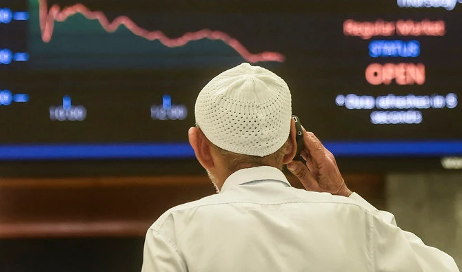 A stockbroker monitors the latest share prices during a trading session at the Pakistan Stock Exchange (PSX) in Karachi on February 24, 2022. (AFP/File)