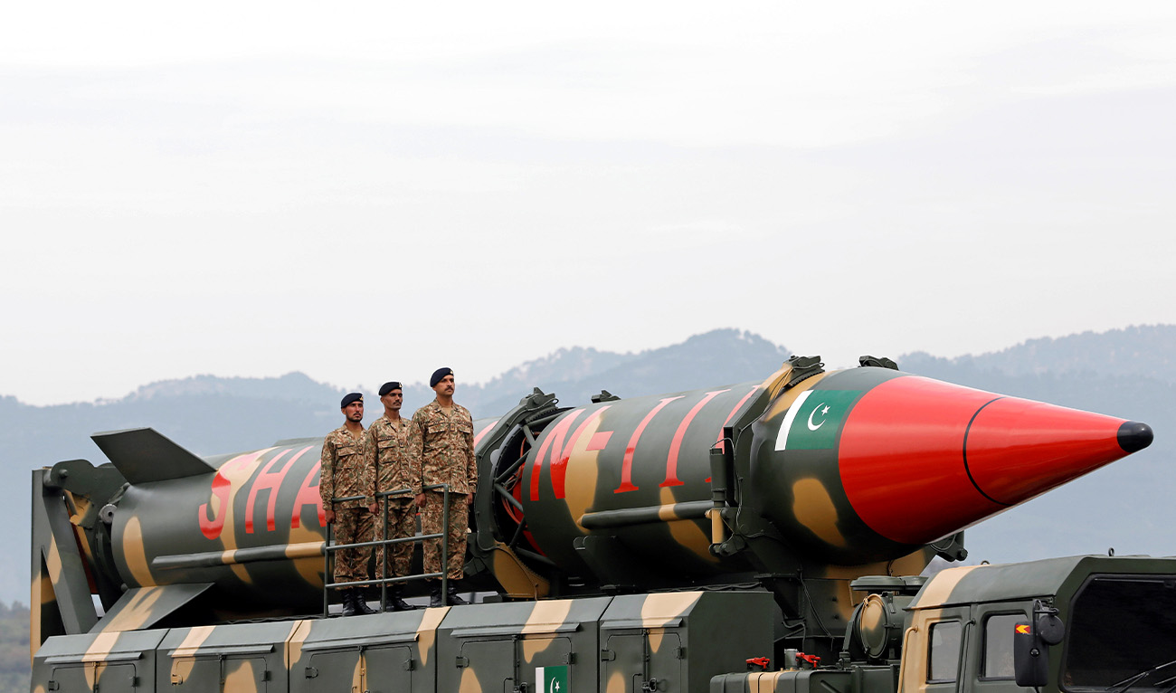 Pakistani military personnel stand beside a Shaheen III surface-to-surface ballistic missile during Pakistan Day military parade in Islamabad, Pakistan March 23, 2019. (REUTERS)
