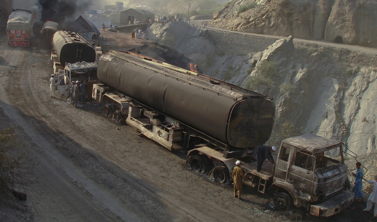 Oil tankers are seen damaged along the roadside after they were hit by a bomb attack in the outskirts of Landikotal, northwest Pakistan on August 16, 2011. (AFP/ File)
