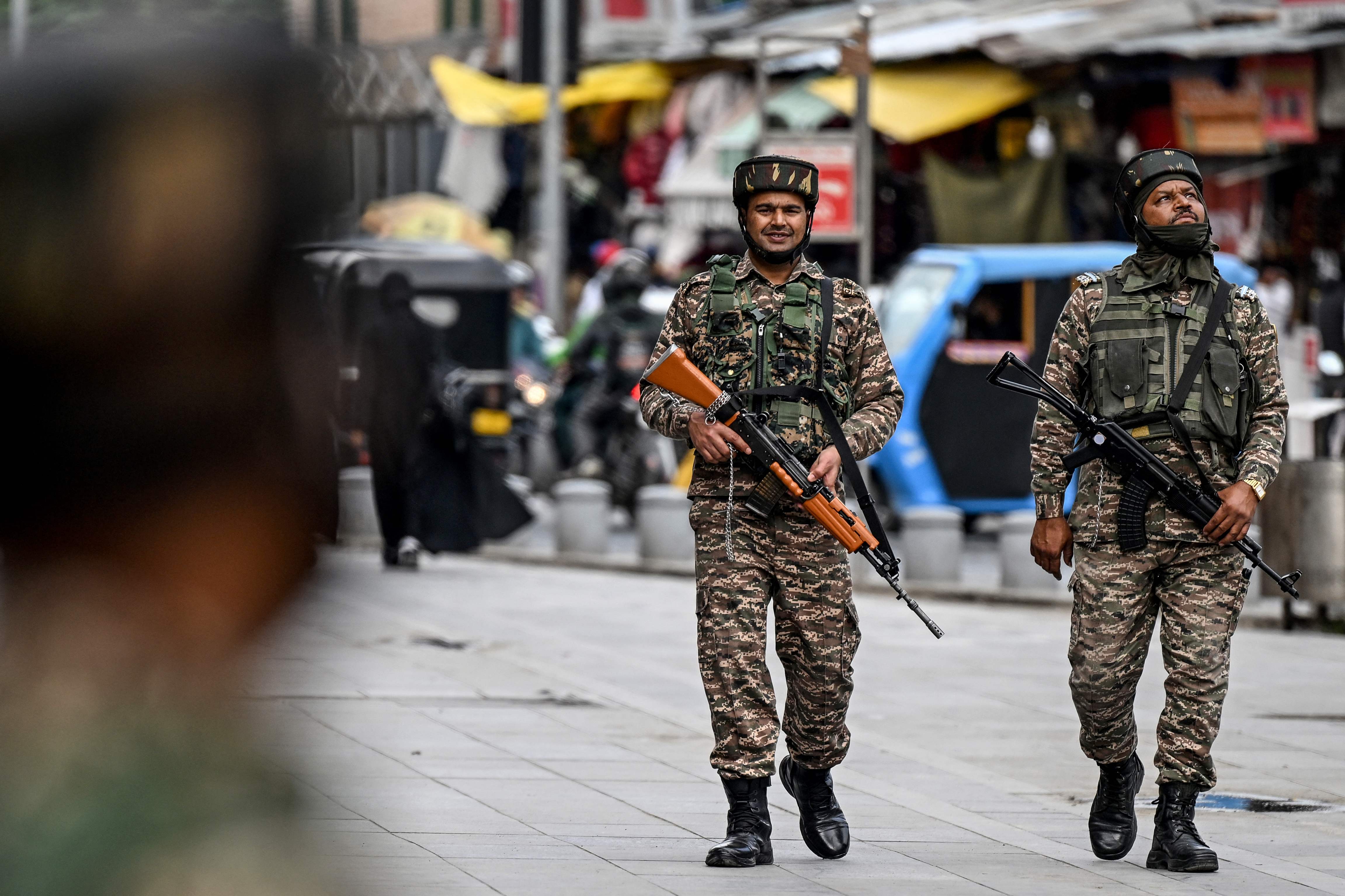 Indian paramilitary soldiers patrol along a street in Srinagar on May 3, 2025. (AFP/File)